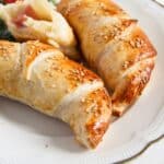 pinterest image with title for ham and cheese puff pastry croissants.