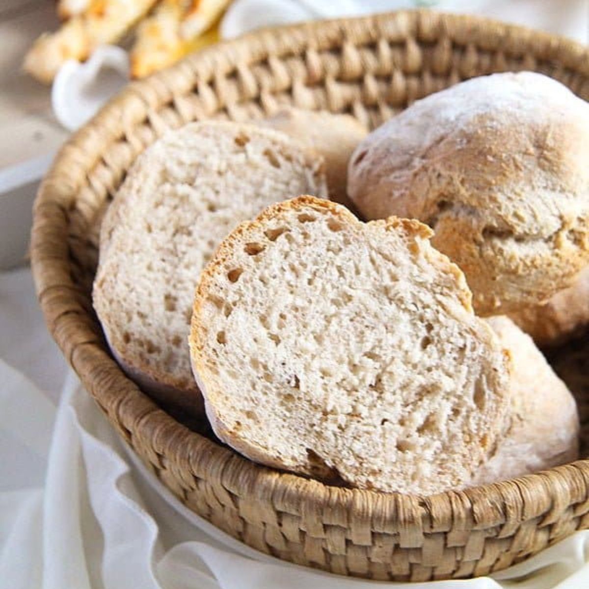 overnight yeast rolls in a small bread basket.