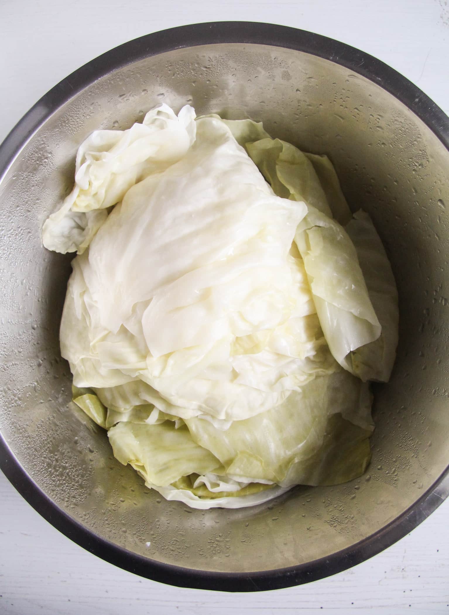 cabbage leaves prepared for stuffing in a bowl.