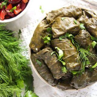 bowl with vegetarian stuffed grapes leaves with rice and cheese