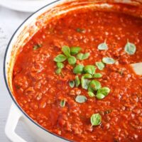 Italian ground meat sauce with tomatoes, garlic and basil in a cast-iron dish