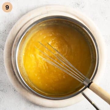 whisking thickend orange filling for cake in a small saucepan.