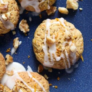carrot orange cookies topped with walnuts