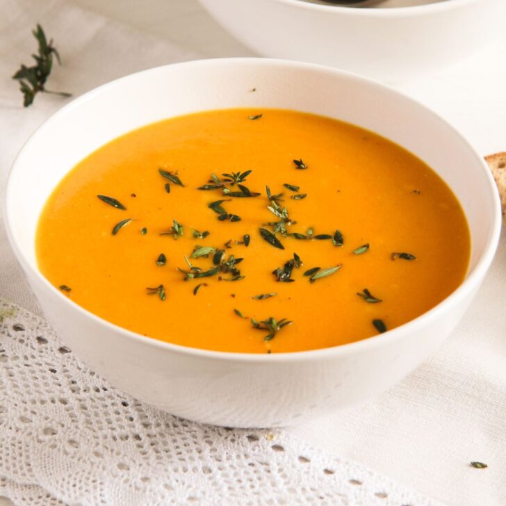 cream of carrot soup with milk in a bowl.