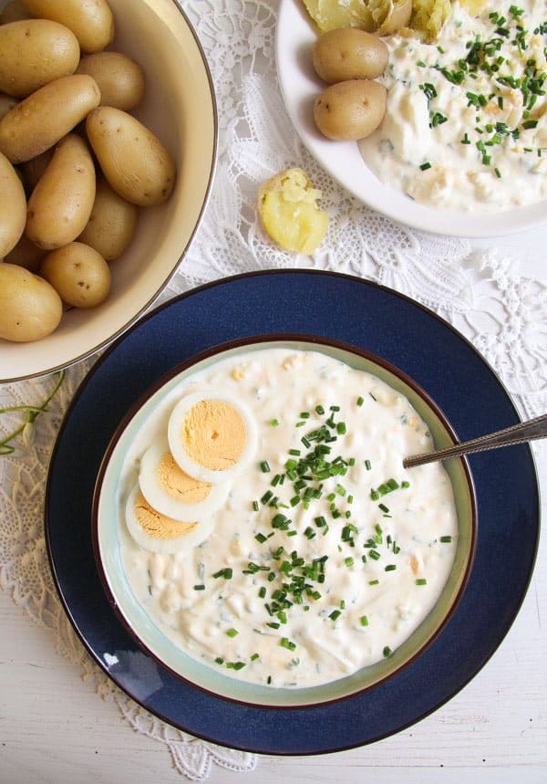 bowl of salad with yogurt, chopped eggs and chives