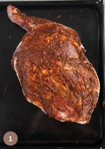 raw shoulder of lamb smeared with a wet spice mixture.