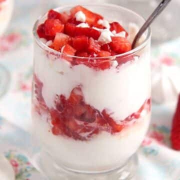 meringue strawberry cream dessert layered in a glass.