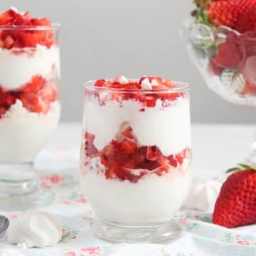 strawberry meringue dessert cups with fresh strawberries.