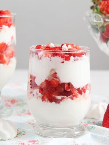 strawberry meringue dessert cups with fresh strawberries.