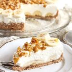 banana pie with cream, caramel and candied walnuts on a plate