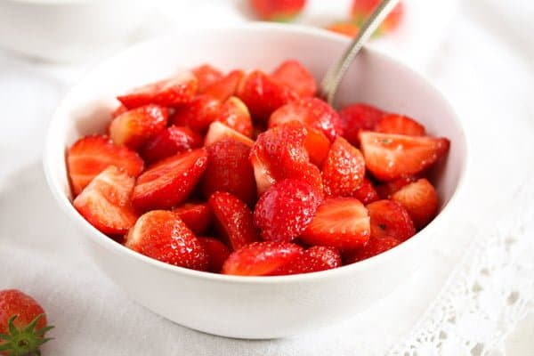 small bowl with macerated strawberries ready to be served