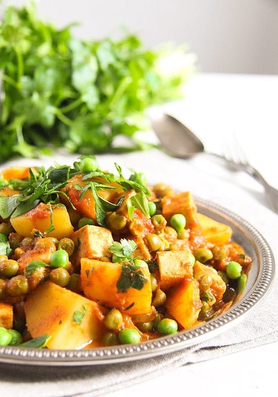 vegan curry with potatoes and tofu on a plate