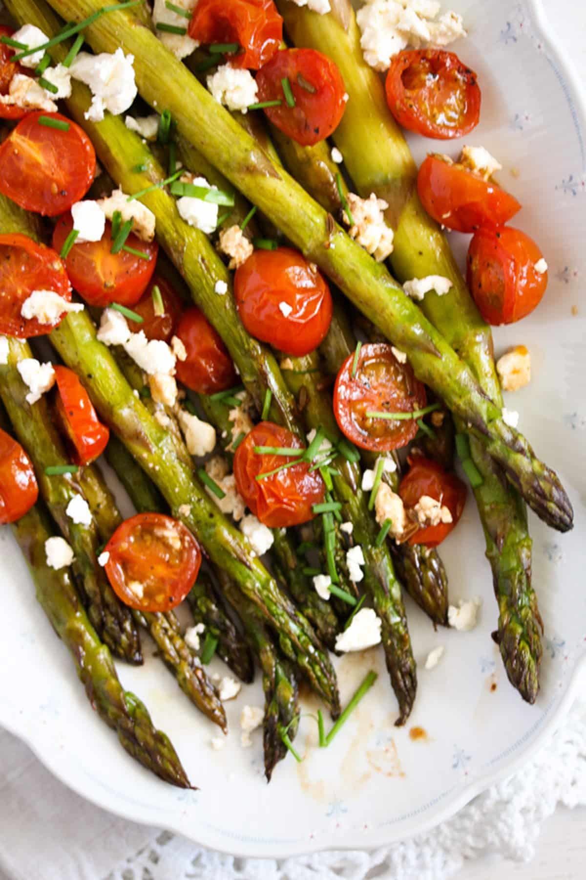 platter with roasted asparagus and roasted cherry tomatoes.