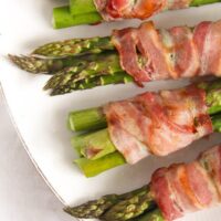 green asparagus bundles wrapped with bacon slices