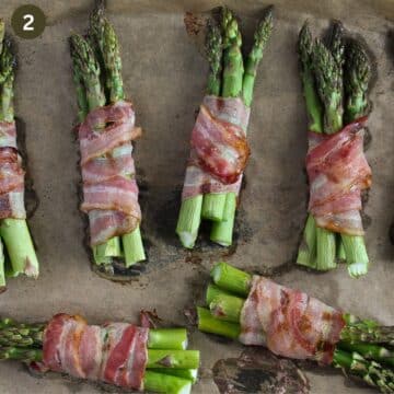 bacon-wrapped asparagus on a baking sheet lined with parchment paper.