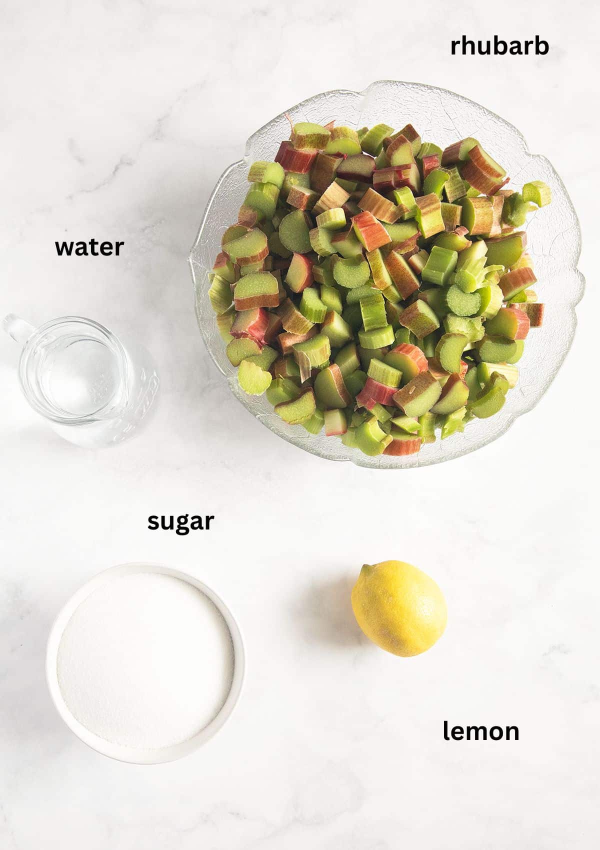 labeled ingredients for making fruit butter with rhubarb, sugar, lemon and water.