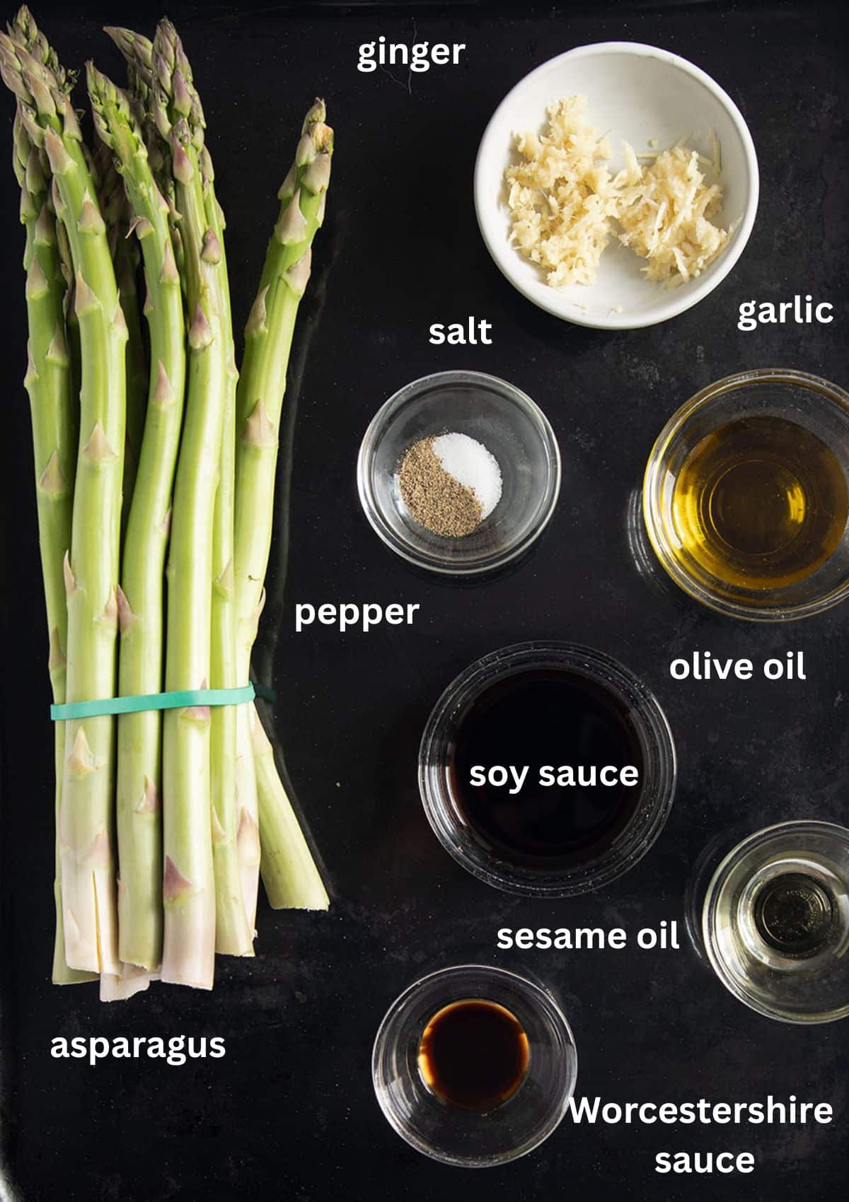 labeled ingredients for making sauteed asparagus with garlic, ginger and soy sauce.