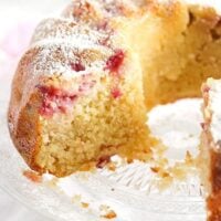 small image of a rhubarb strawberry bundt cake on a platter.