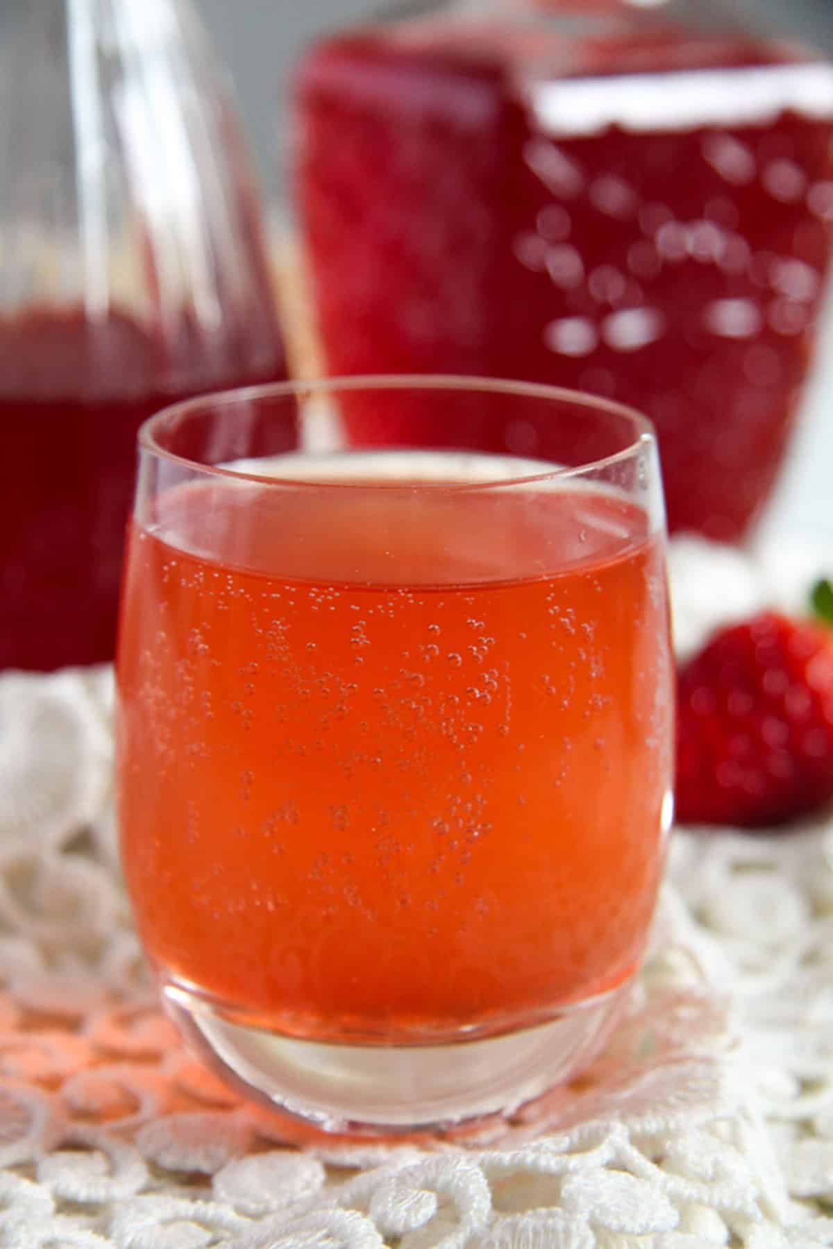 one glass of strawberry syrup mixed with water.
