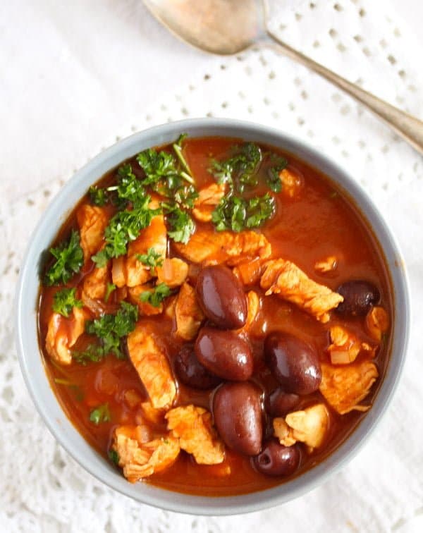 chicken stew with olives in a bowl seen from above