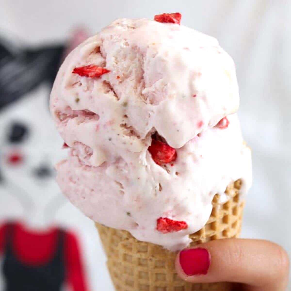 Strawberry ice cream with chunks of strawberries in each scoop