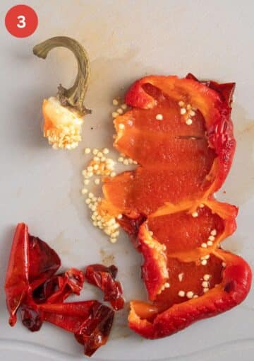 peeling and deseeding a roasted red pepper.
