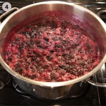 cooking blueberry sauce in a large pot.