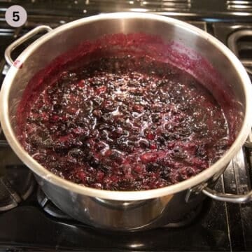 cooking blueberry sauce in large, heavy-bottomed pot.