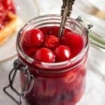 pinterest image of a jar of cherries.