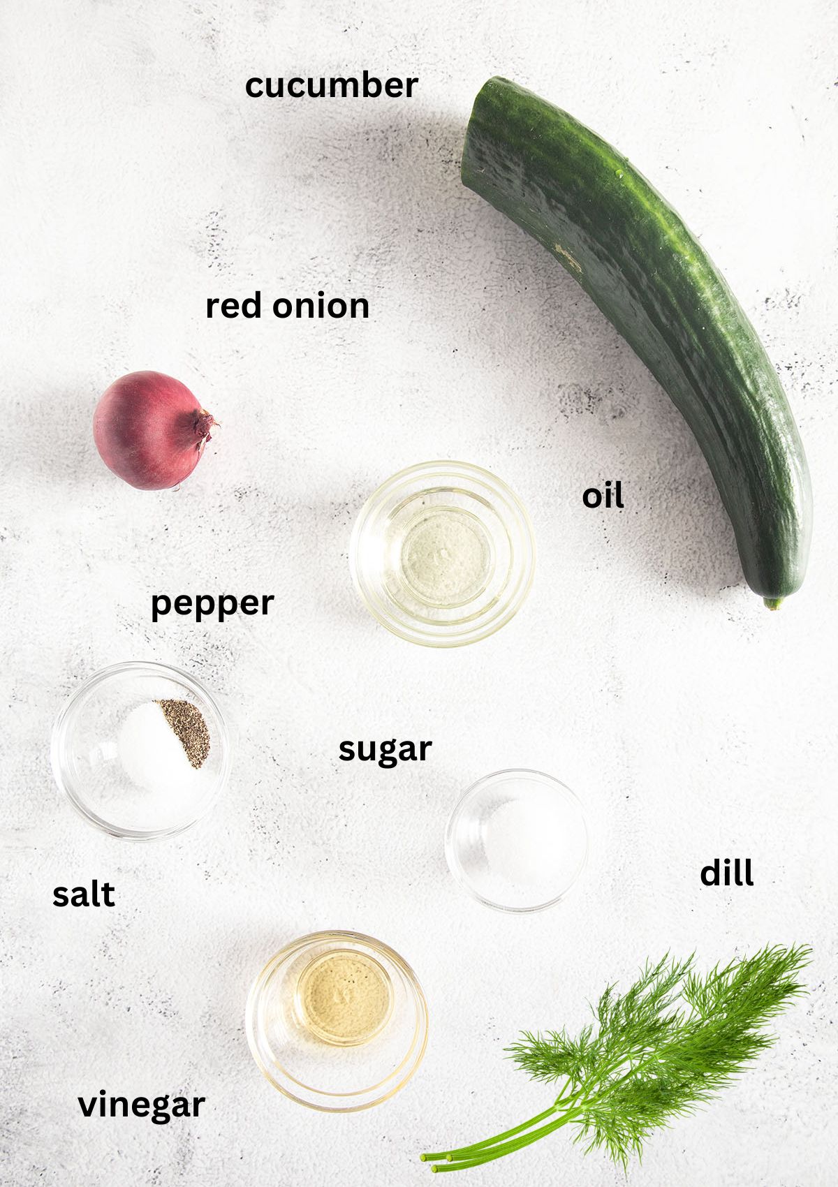 labeled ingredients for making cucumber salad.