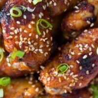 oven baked korean chicken wings sprinkled with green onions and sesame seeds