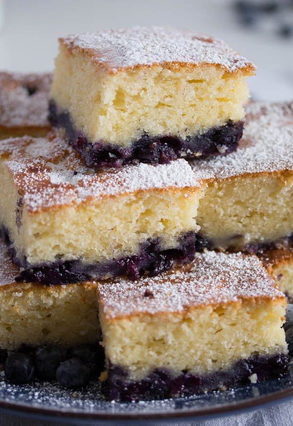 slices of sour cream cake with blueberries