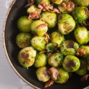 german brussels sprouts with bacon in a small pan.
