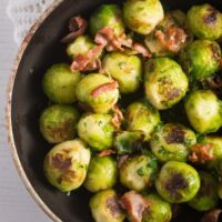 close up pan roasted brussels sprouts with bacon and garlic