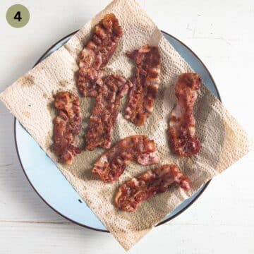draining bacon slices on kitchen paper.