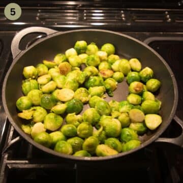 frying brussels sprouts in a large bacon pan.