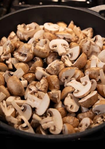fresh chopped mushrooms in a skillet.