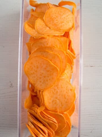 very thin sweet potato slices cut with a mandoline.