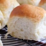 soft yeast rolls on a wire rack