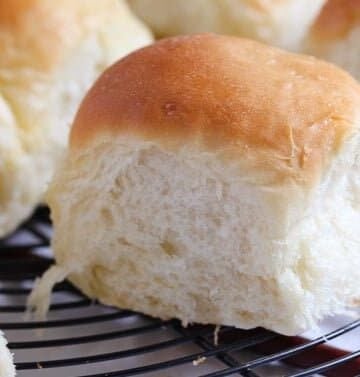 soft yeast rolls on a wire rack