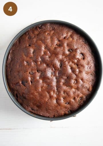 brown baked fruitcake without alcohol cooling in a the cake pan.
