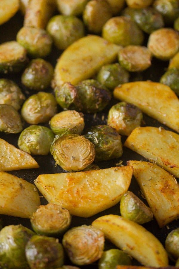 roasted brussels sprouts and potatoes being served.