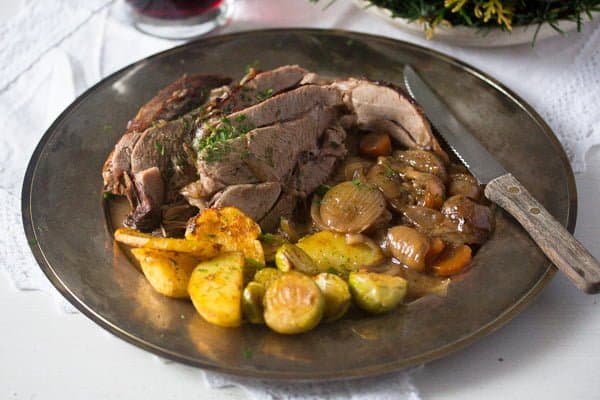 small image of sliced meat with potatoes and shallots.