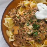 ground beef and mushrooms sauce with noodles.