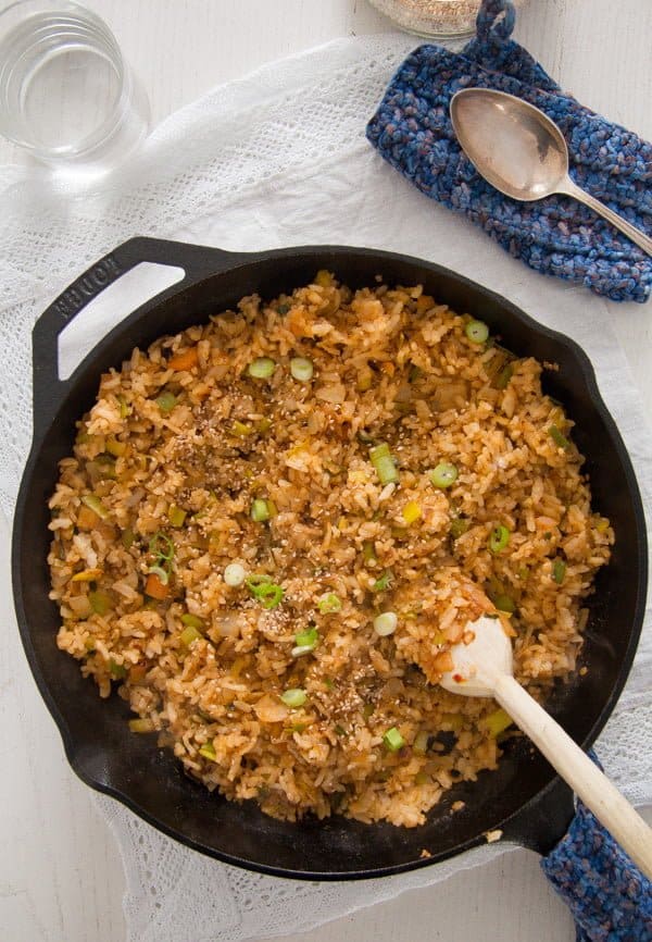 cast iron skillet with fried rice and kimchi