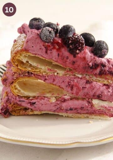 one slice of cake with puff pastry and berry cream layers.