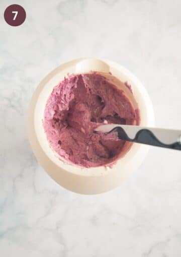 folding blended berries into whipped cream with a rubber spatula.