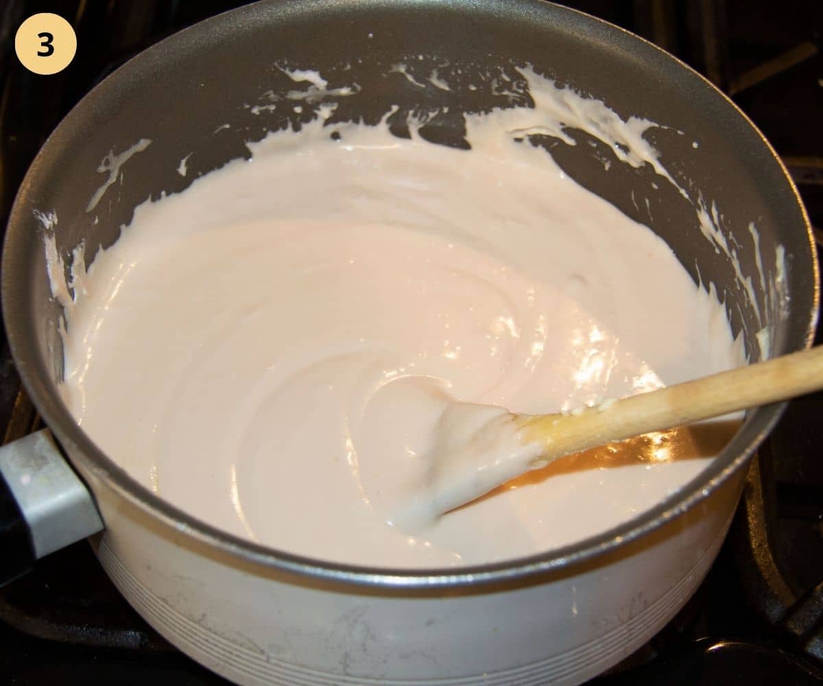 mixing marshmallow fluff and white chocolate in a pot.