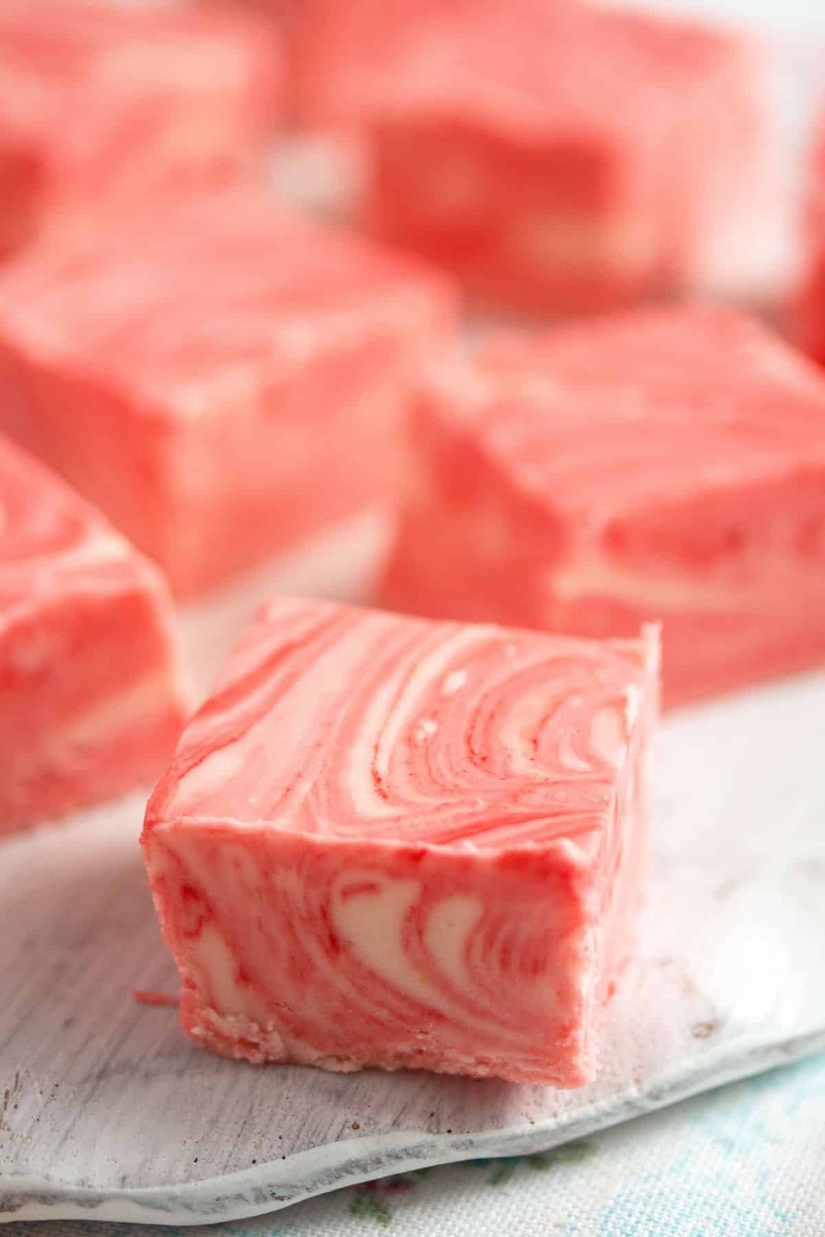 cubes of pink swirled fudge close up.