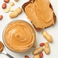 peanut butter in bowl and on bread.